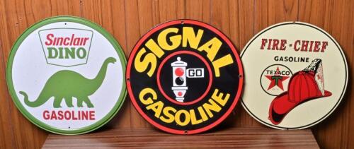 GASOLINE: Three reproduction tin signs, one embossed and the Signal being enamel, 28.5cm diameter