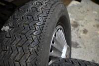 Four Mustang wheels, hubcaps and tyres, 3 fitted with Firestone Cavallino Sport 200 radial (185 SR 14 )and the other with a Goodyear - 5