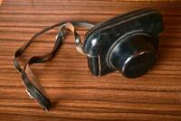 CAMERA: A early 1960s Canon 'Canonet' with fitted leather case, stamped '1580430'.
