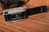 CAMERA: A early 1960s Canon 'Canonet' with fitted leather case, stamped '1580430'. - 3