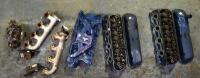 MUSTANG: A collection of Ford V8 engine parts including a manifold, two heads, two manifolds and two engine mounts