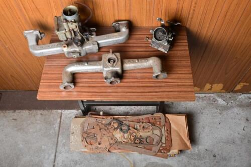 HOLDEN: A collection of engine related items including two manifolds, one numbered 7429469, two Stromberg carbys and a large collection of miscellaneous gaskets