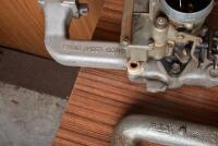 HOLDEN: A collection of engine related items including two manifolds, one numbered 7429469, two Stromberg carbys and a large collection of miscellaneous gaskets - 6