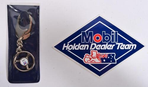 HDT: A MHDT NOS keyring in original packaging, as per the 1986 merchandising catalogue code no 75306, and a MHDT sticker