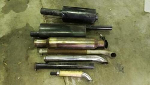 MUFFLERS: Nine assorted mufflers and pipes