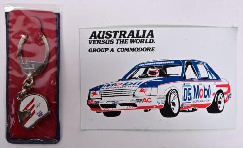 HDT: A MHDT NOS keyring in original packaging, as per the 1986 merchandising catalogue code no 75305, and a MHDT sticker postcard