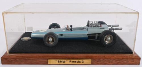 BMW: A circa 1950s Schuco tinplate clockwork model of a BMW Formula 2 open wheeler racing car, 26cm long, in later associated display box