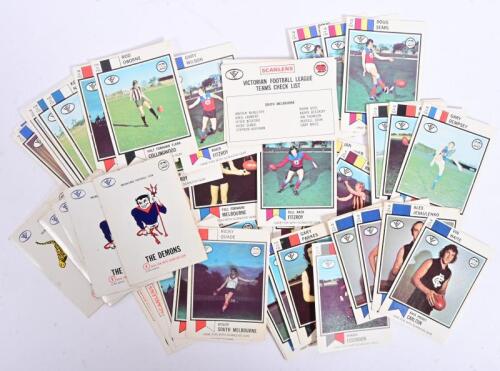 VFL: An interesting group of 'SCANLENS' V.F.L Football cards featuring V.F.L players from various clubs, together with 'SCANLENS GUM' stickers depicting various V.F.L team club mascots. Circa 1973