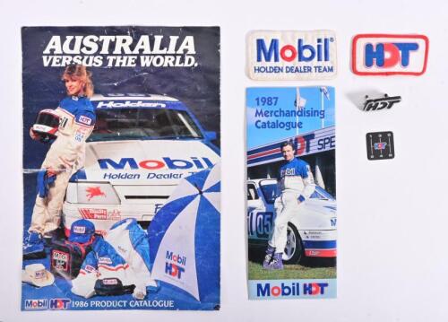HOLDEN/HDT: An interesting group of Holden HDT items including 1986 and 1987 product/merchandise catalogues, two cloth Holden HDT badges, HDT car grill badge, small HDT gear selector plastic adhesive