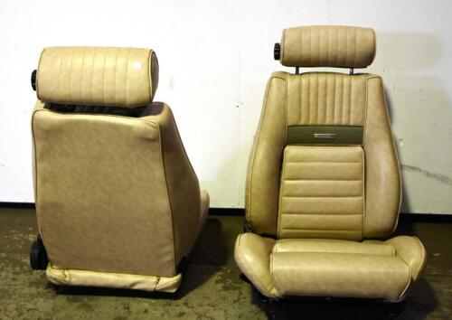 MUSTANG: A pair of circa 1970s vinyl seats with pony pressed feature, with rails and adjustable headrests