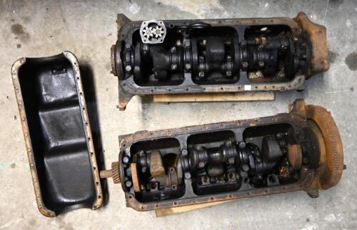 GMH: Two GMG 6-cylinder engine crank cases with internals and a sump cover, the early one with cast No. 7400479, other No. 7408858, trollies not included