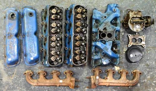 MUSTANG: A collection of Ford V8 engine parts including a manifold, 2-barrel carby, two heads and two manifolds