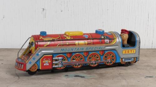 TIN TOY: A 1960s Japanese battery operated tin "Mountain Special" locomotive by Modern Toys, 40cm long