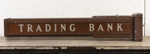 BANK: An original Art Deco wall mounted double sided signpost with glass insert 'Trading Bank', 102cm long