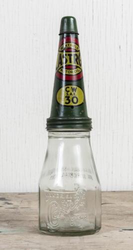 CASTROL: A circa 1950s Castrol Wakefield one imperial pint embossed glass oil bottle with early CW SAE 30 tin pourer