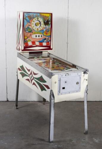PINBALL MACHINE: A 1960s 'Beat the Clock' pinball machine by Williams Electronic Manufacturing Corporation (1958-1967), 176cm high, 140cm wide, 61cm deep