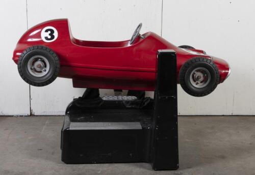 RACE CAR RIDE: A circa 1960/70s RGM Red Flash coin operated race car amusement ride in the form of a open wheel Grand prix racing car, last know operation was in 2005, recently untested, complete with coin slot mechanism stored inside base, 95cm high, 16