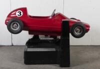 RACE CAR RIDE: A circa 1960/70s RGM Red Flash coin operated race car amusement ride in the form of a open wheel Grand prix racing car, last know operation was in 2005, recently untested, complete with coin slot mechanism stored inside base, 95cm high, 16