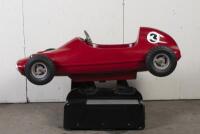 RACE CAR RIDE: A circa 1960/70s RGM Red Flash coin operated race car amusement ride in the form of a open wheel Grand prix racing car, last know operation was in 2005, recently untested, complete with coin slot mechanism stored inside base, 95cm high, 16 - 4