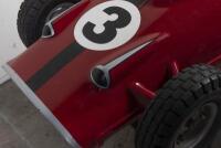 RACE CAR RIDE: A circa 1960/70s RGM Red Flash coin operated race car amusement ride in the form of a open wheel Grand prix racing car, last know operation was in 2005, recently untested, complete with coin slot mechanism stored inside base, 95cm high, 16 - 8