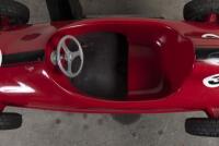 RACE CAR RIDE: A circa 1960/70s RGM Red Flash coin operated race car amusement ride in the form of a open wheel Grand prix racing car, last know operation was in 2005, recently untested, complete with coin slot mechanism stored inside base, 95cm high, 16 - 9