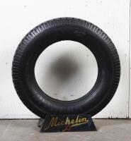 MICHELIN: A circa 19 Michelin Confort tyre on printed tin tyre stand, 88cm high overall - 2