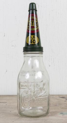 CASTROL: A circa 1950s Castrol Wakefield one imperial quart embossed glass oil bottle with early CW SAE 40 tin pourer
