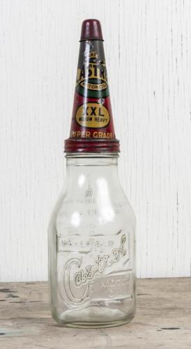 CASTROL: A circa 1950s Castrol Wakefield one imperial quart embossed glass oil bottle with early Super Grade XXL Medium Heavy tin pourer