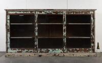 DISPLAY CASE: A large three sliding door display case with distressed finish, first half of the 20th century, 121.5cm high, 234cm wide, 54cm deep