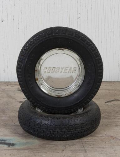 GOODYEAR: Two Goodyear novelty ashtray in the form of a tyre with grass inserts, 14.5 and 15cm diameter