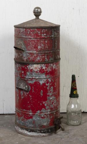 OIL FILTER: A 1920s Perfectum oil filter in two sections with accessories, printed to the front 'Wm Adams, Sydney', in original condition, 87cm high, 37cm diameter (glass bottle not included)