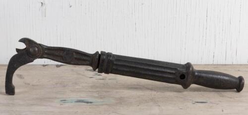 GRIPS: An early set of cast iron grips with extendable handle, 57cm long when extended