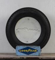 GOODYEAR: A circa 1960s Goodyear tyre with printed and embossed plastic sign on tin tyre stand, the tyre stand printed to lower right hand side: Standard Industries Pty Ltd Sydney 2.67, 74cm high overall - 2