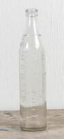 MOBIL: A circa 1930s one imperial quart embossed glass oil bottle