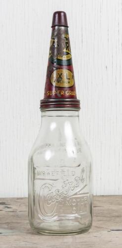 CASTROL: A circa 1950s Castrol Wakefield one imperial quart embossed glass oil bottle with early Super Grade XL Medium tin pourer