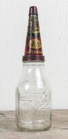 CASTROL: A circa 1950s Castrol Wakefield one imperial quart embossed glass oil bottle with early Super Grade XL Medium tin pourer
