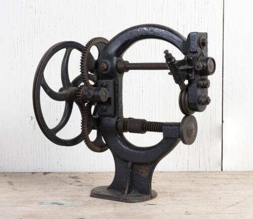 LEATHERWORKING: A cast iron device probably for impressing a trimming leather, 39.5cm high