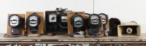 ELECTICITY METERS: A collection of seven vintage electricity meters and two loud speaker cones