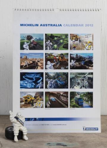 MICHELIN: A circa 1990s figure of Bibendum seated on a tyre for dashboards and a 2012 Michelin promotional calendar, Bib 8.5cm high