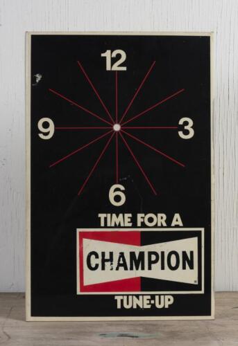 CHAMPION: A Champion plastic clock, lacking a clock movement, 46.5 x 31cm