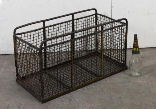 WIRE CRATE: A large vintage iron wire crate, 49cm high, 88cm wide, 42cm deep (bottle not included)