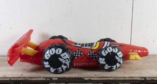 GOODYEAR: An inflatable Grand Prix race car made by sponsors Fosters lager, 90cm long approx.