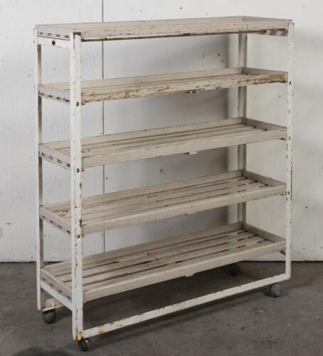SHELVES: A vintage industrial set of five shelves on castors, 131cm high, 115cm wide, 37cm deep