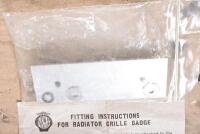 GRILLE BADGES: A NRMA badge with mounting bracket and an Eastern Creek Classic badge - 6