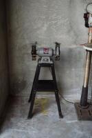WORKSHOP: A collection of workshop equipment including a bench grinder, spare grinding wheel; and stands