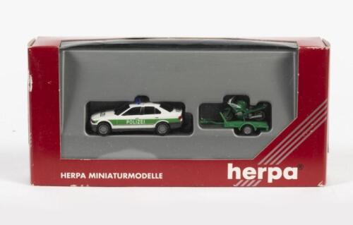 HERPA: A NOS HO scale model rail German police car and motorbike trailer