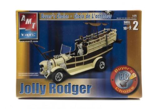 MODEL KIT: A NOS 1:25 scale AMT Jolly Rodger model kit and Revell Chevy 283 c.i V8 engine parts pack; including a white and brown Jolly Rodger 'boat' car with skeleton; 42 chrome plated pieces for the Chevy engine; with original sealed box.