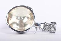 PILLAR LAMP: A 1920s American windscreen adjustable pillar mounted chromed brass spotlight, 23cm long, glass 11.5cm diameter