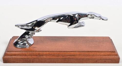 DELAGE: A 1920s nickle plated 'Leaping Greyhound' for Delage after Casimir Brau mounted on wooden stand, later replated, 18cm long