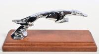 DELAGE: A 1920s nickle plated 'Leaping Greyhound' for Delage after Casimir Brau mounted on wooden stand, later replated, 18cm long